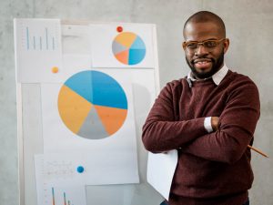 front-view-smiley-man-doing-presentation-during-meeting